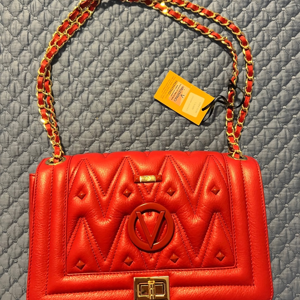 Valentino Candystud was made from deep -red, quilted veal leather.